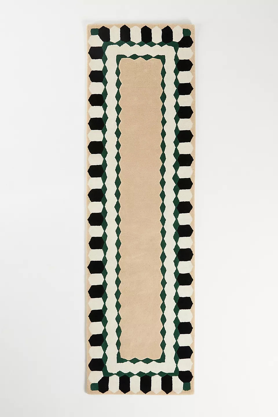 Rectangular rug with geometric border on a white background
