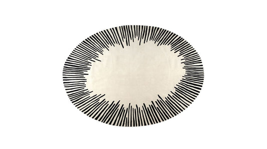 Hand-tufted Modern Oval Cream Rug featuring a black sunburst design, crafted from handmade wool