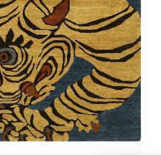 Close-up of a tiger design on a rug with a blue background