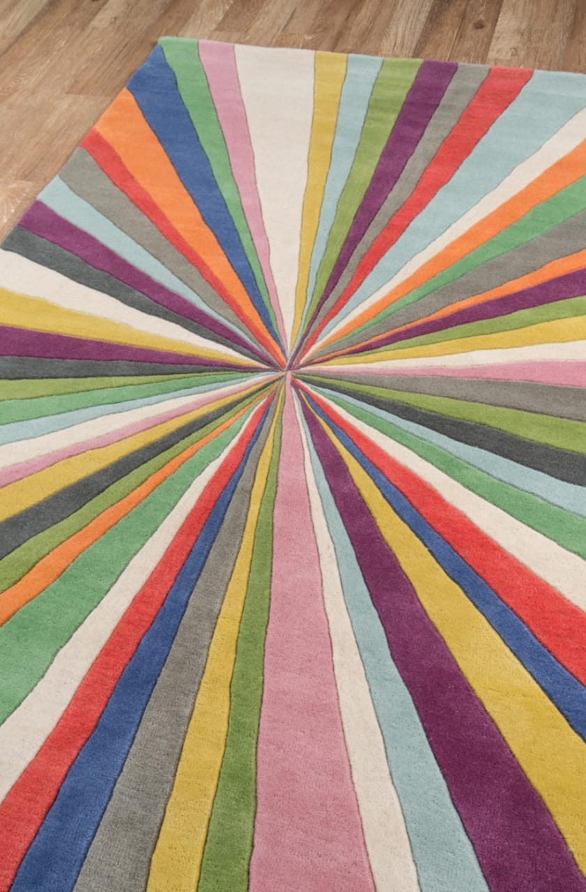 Multicolored starburst pattern rug on a wooden floor