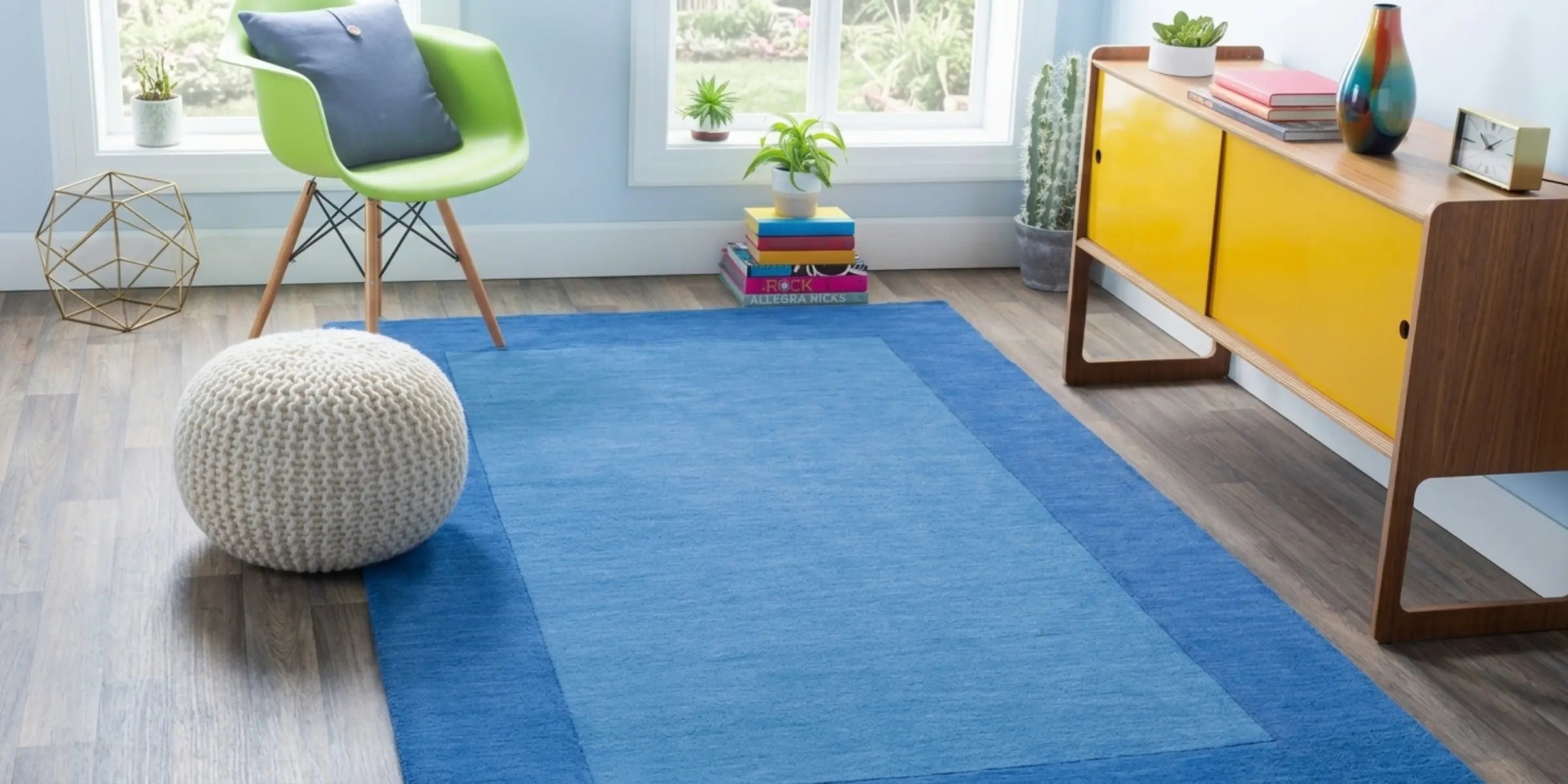 Solid blue area rug with a two-tone design featuring a light cerulean center and a darker royal blue rectangular border.