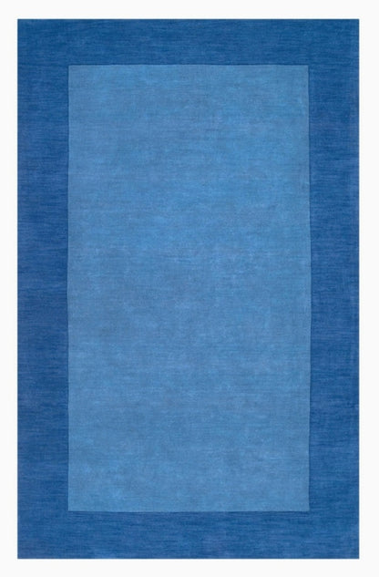 Rectangular blue rug with a solid color design on a white background