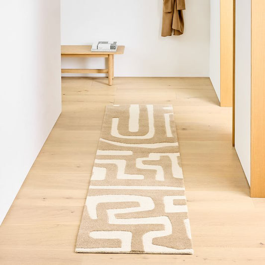 Hand-tufted wool runner rug with beige and ivory abstract line pattern