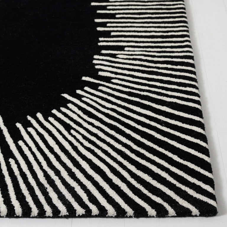 Black and white striped rug on a plain background