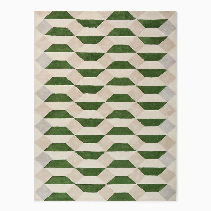 Overhead view of a rectangular hand-tufted wool rug featuring a 3D geometric pattern in forest green, beige, and light grey tones.
