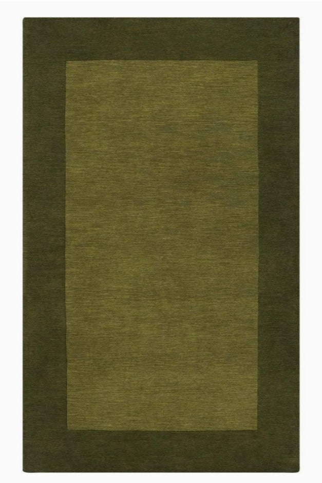 Overhead view of a rectangular hand-tufted wool rug with an olive green center and a dark forest green border.