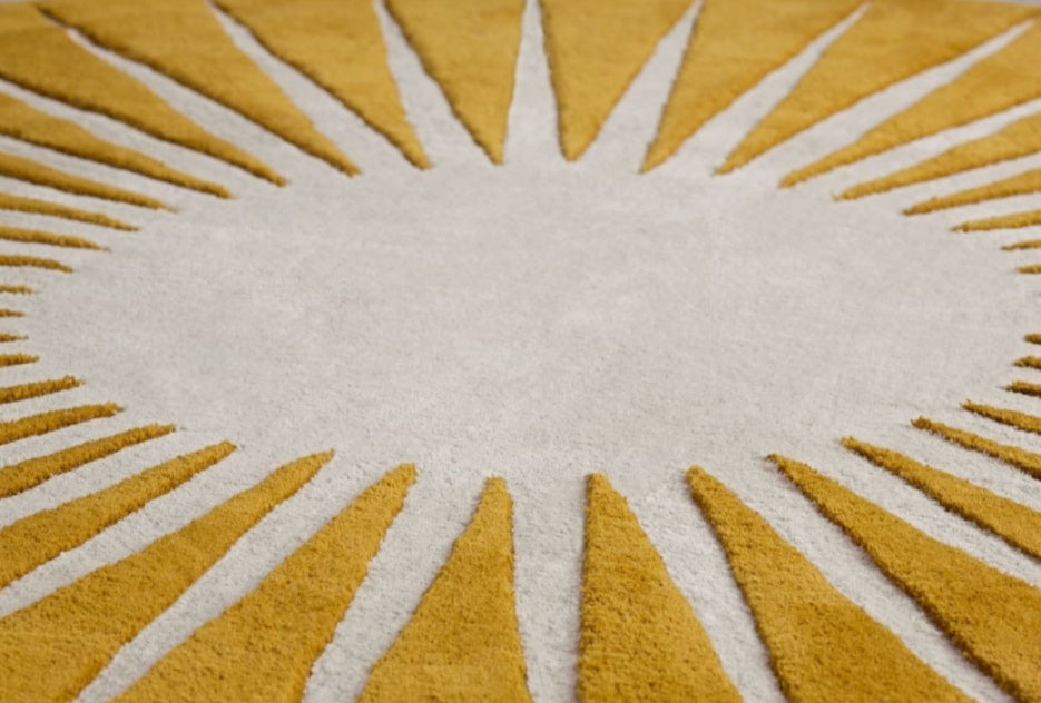 Close-up of a yellow and white geometric patterned rug