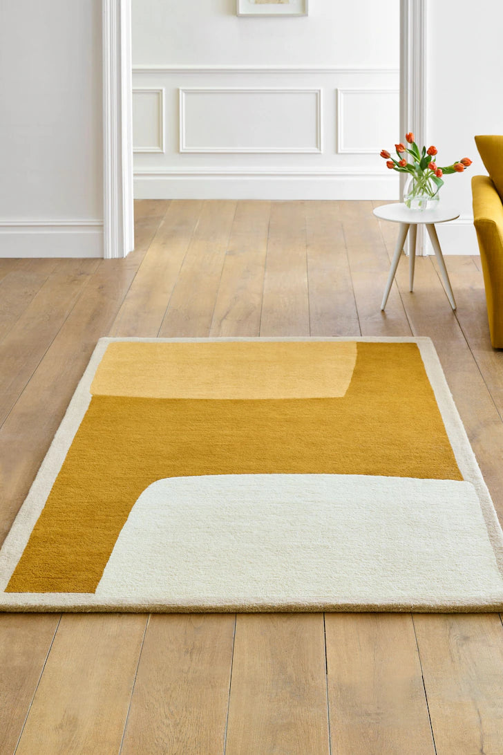 Hand-tufted wool rug with mustard, beige, and ivory abstract block design