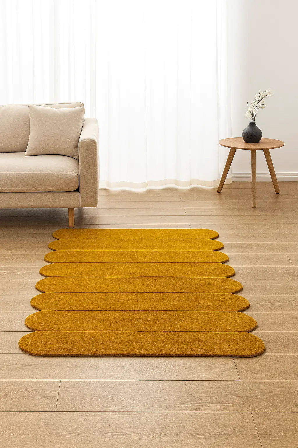 Yellow rug on a wooden floor with a beige sofa and small table in the background.